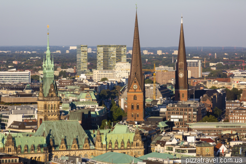 Aerial view of the City Hall, Church of Saint Peter and St. James' Church in Hamburg